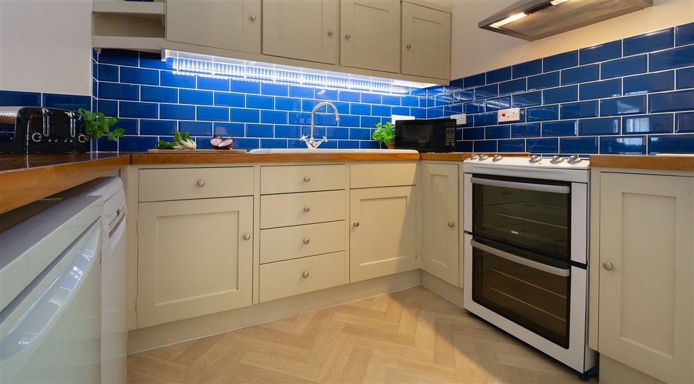 The ktichen area in the open-plan kitchen, dining and sitting room (photo 2) at Watermill Apartment in Burnham-overy-staithe, Norfolk