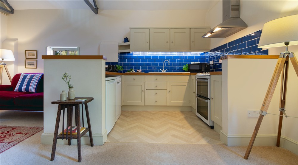 The ktichen area in the open-plan kitchen, dining and sitting room at Watermill Apartment in Burnham-overy-staithe, Norfolk