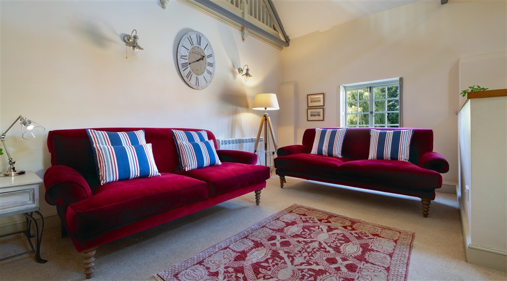 The sitting area in the open-plan kitchen, dining and sitting room at Watermill Apartment in Burnham-overy-staithe, Norfolk