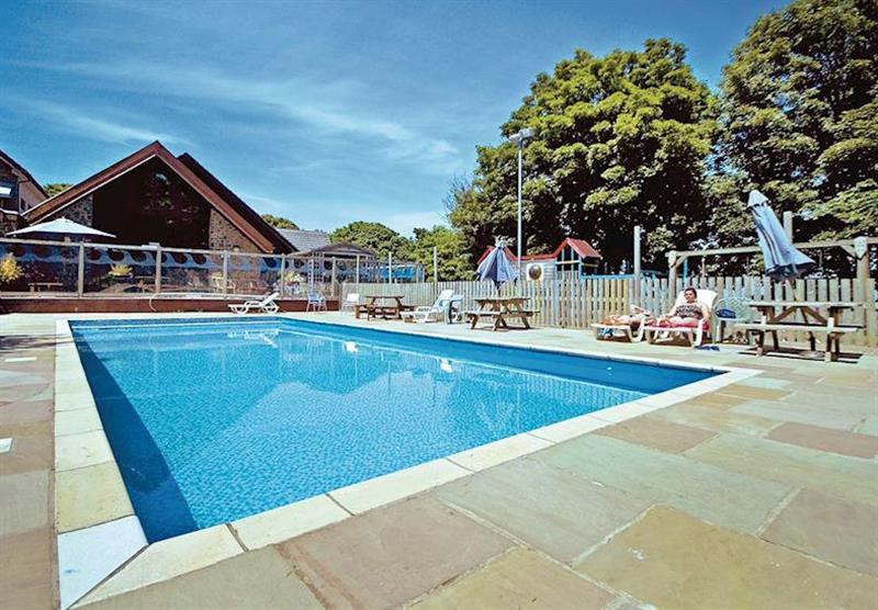 Outdoor heated swimming pool at Watermouth Lodges in Berrynarbor, Ilfracombe, Devon