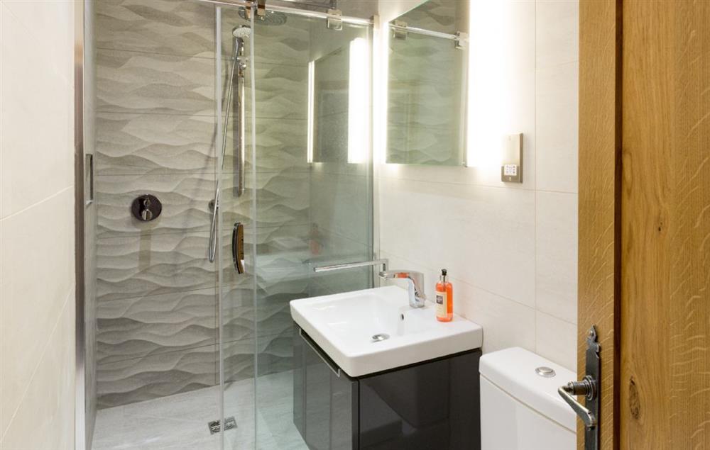 First floor: Fusedale - en-suite natural stone shower room with monsoon and raindrop showers at Waternook, Ullswater