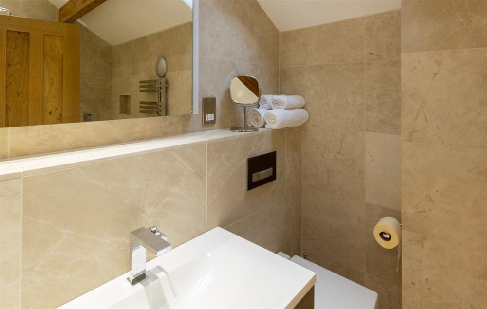 First floor: Hallin - en-suite natural stone shower room with monsoon and raindrop showers and views across Hallin Fell (photo 2)