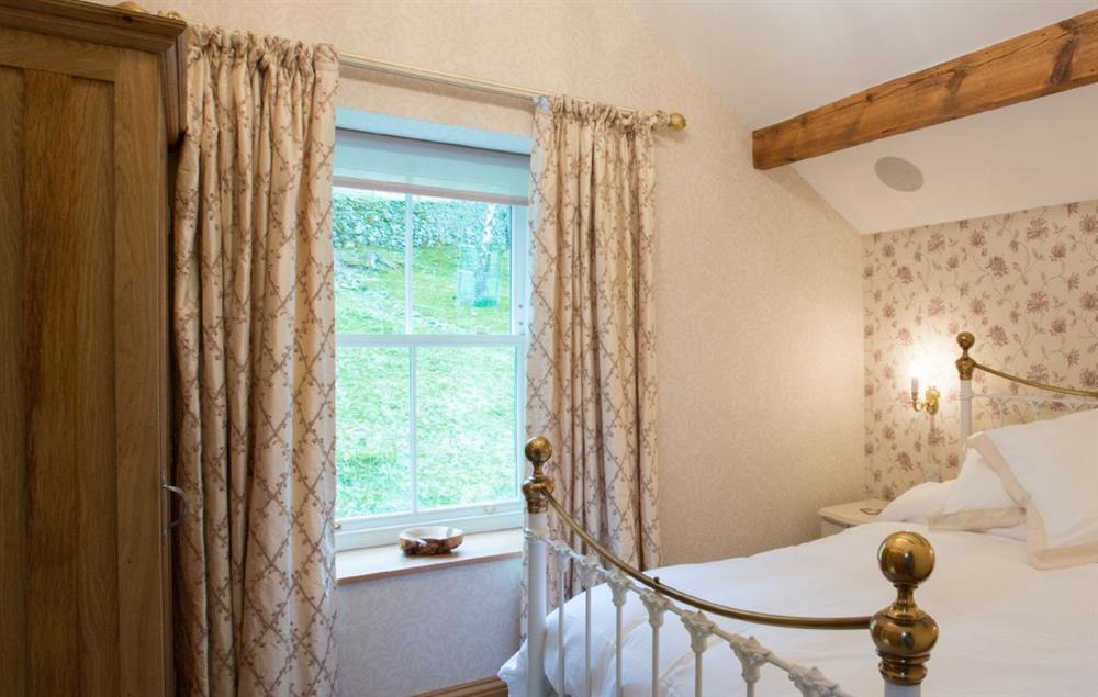 First floor: Hallin has a 4'6 bed with Vispring Elite mattress and en-suite natural stone shower room with monsoon and raindrop showers and views across Hallin Fell
