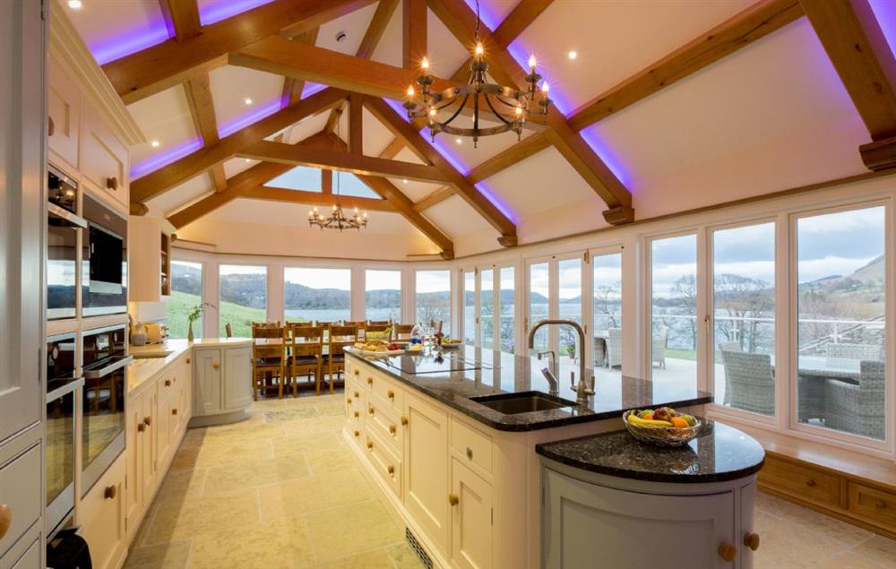 Ground floor: Kitchen with double aspect lake views and french doors opening onto terrace at Waternook, Ullswater