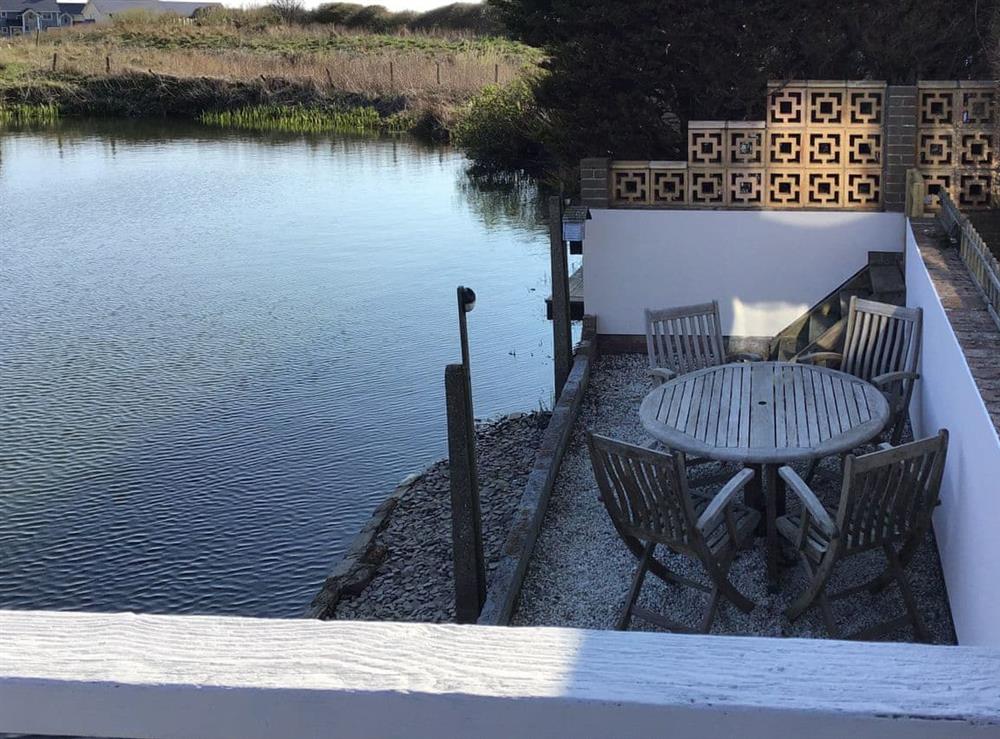 Decked sitting-out area at Waters Edge Holiday Home in Beadnell, Northumberland