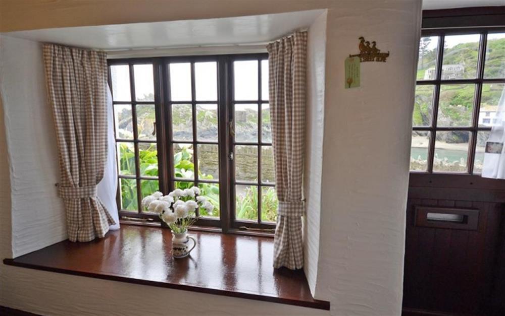 The front door and the picture perfect window at Waters Edge in Polperro