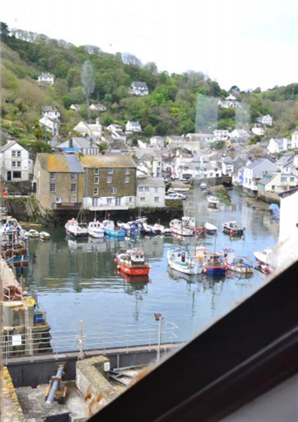Views from the bedroom to the harbour  at Waters Edge in Polperro