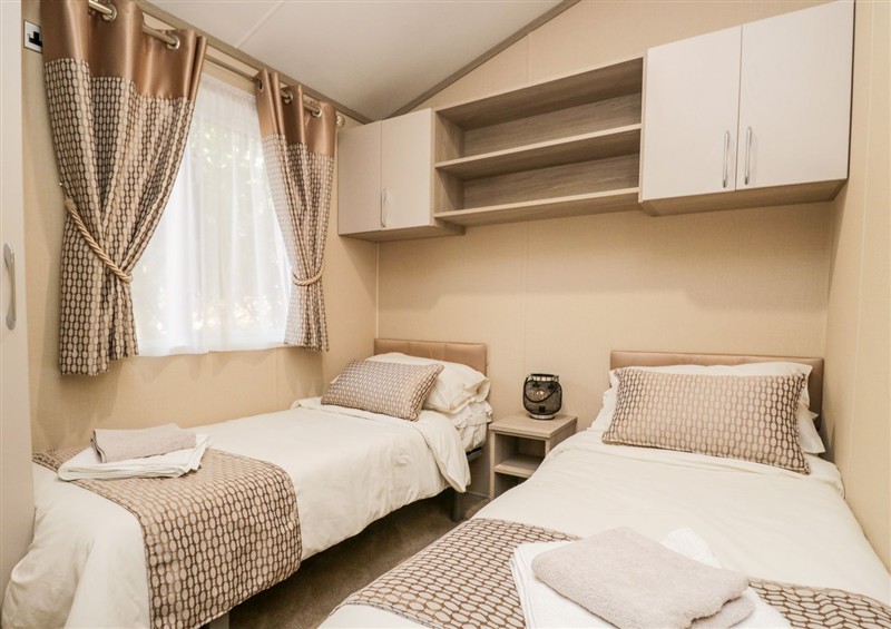 A bedroom in Water's Reach at Waters Reach, White Cross Bay Holiday Park near Troutbeck Bridge