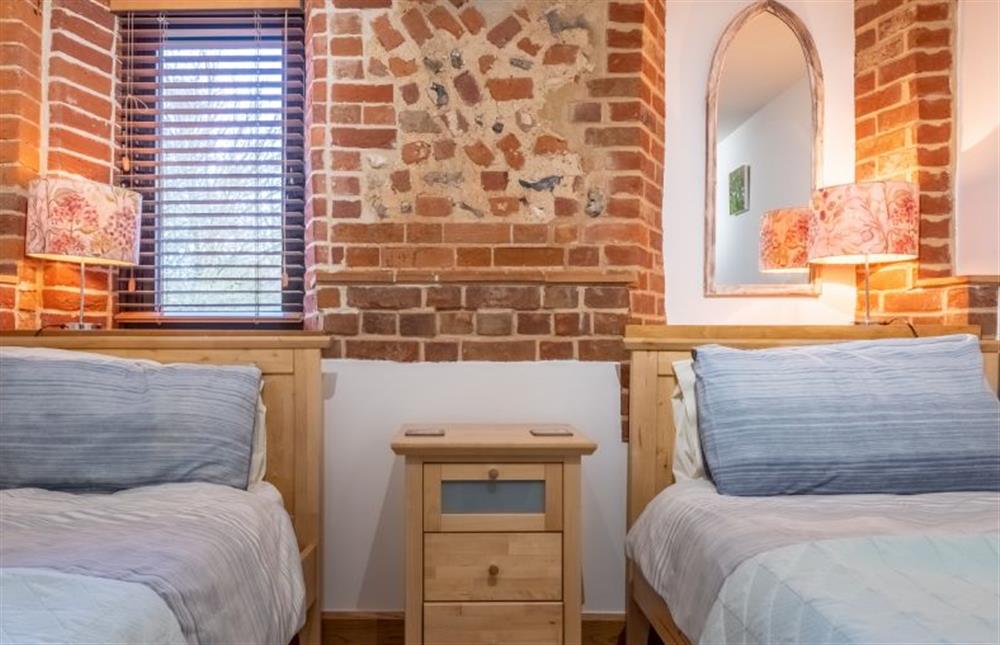Bedroom three with full-size twin beds at Waterside Barn, Binham near Fakenham
