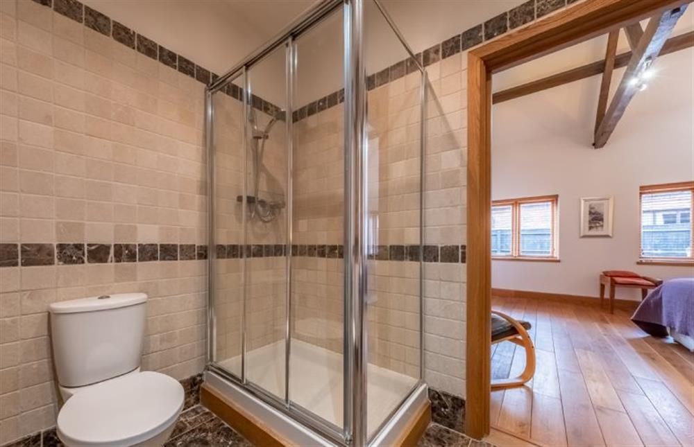 Master en-suite with large shower, wash basin and WC at Waterside Barn, Binham near Fakenham