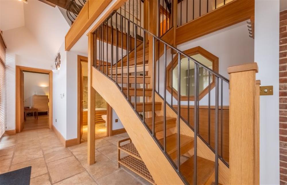 Stairs to the first floor and hall to ground floor bedrooms at Waterside Barn, Binham near Fakenham