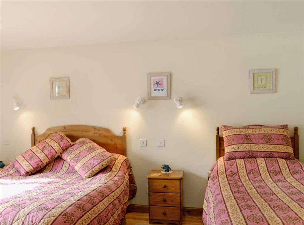 Double bedroom with additional single bed at Waterside in by Inverinate, Kyle, Highland