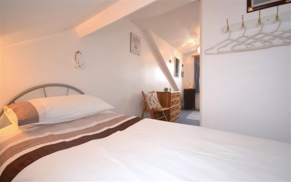 The third bedroom on the second floor also enjoys far-reaching water views from its window. at Waterside Cottage in Appledore