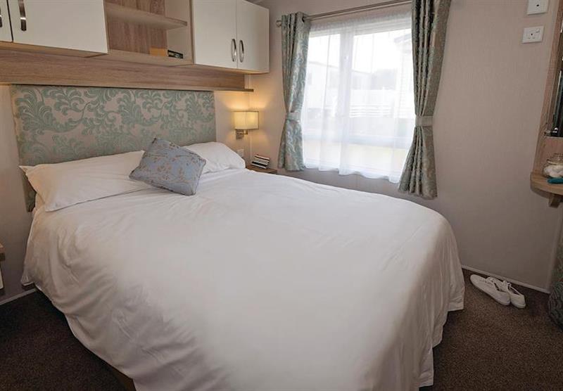 Double bedroom at Avonmore 2 at Waterside Holiday Park and Spa in Weymouth, Dorset