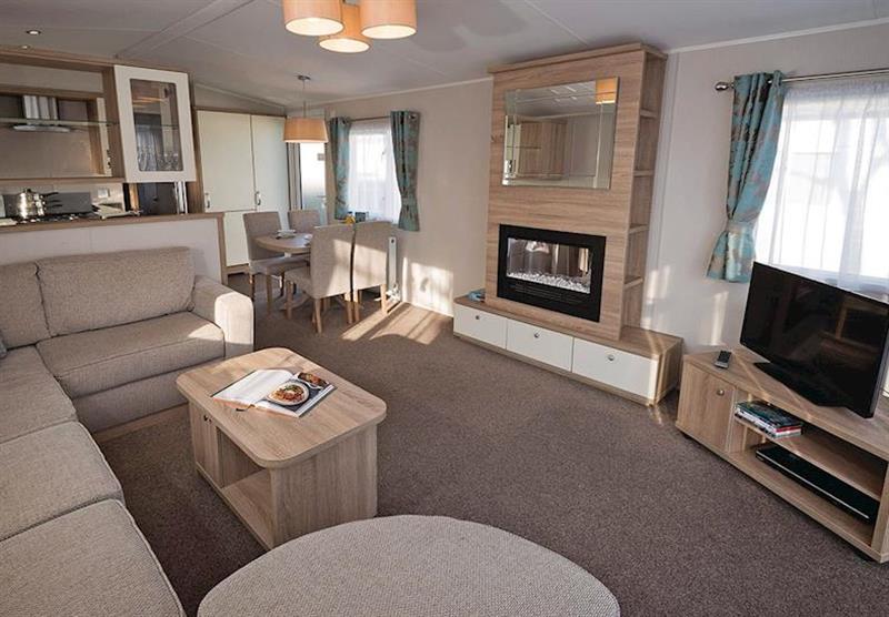 Living room at Avonmore 2 at Waterside Holiday Park and Spa in Weymouth, Dorset