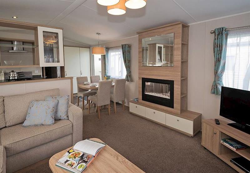 Living room at Avonmore 3 at Waterside Holiday Park and Spa in Weymouth, Dorset
