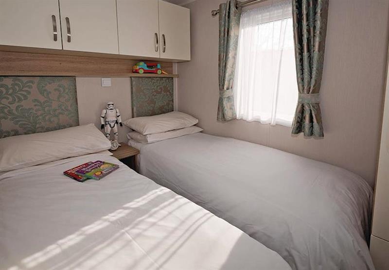 Twin bedroom at Avonmore 2 at Waterside Holiday Park and Spa in Weymouth, Dorset