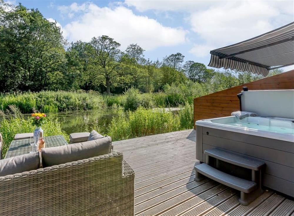 Impressive outdoor area with hot tub at Waterside Lodge in Elland, near Brighouse, Staffordshire