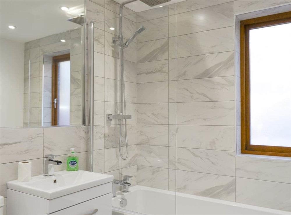 En-suite Bathroom with shower over bath at Waterside Lodge Sixteen in Elland, near Brighouse, West Yorkshire