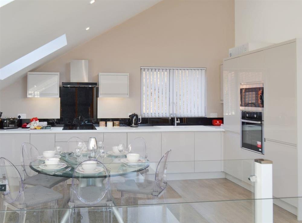 Fully appointed kitchen with dining area at Waterside Lodge Sixteen in Elland, near Brighouse, West Yorkshire