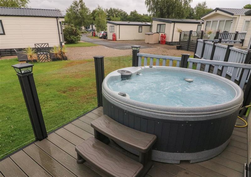 Enjoy the hot tub at Waterside Lodge, South Lakeland Leisure Village near Carnforth