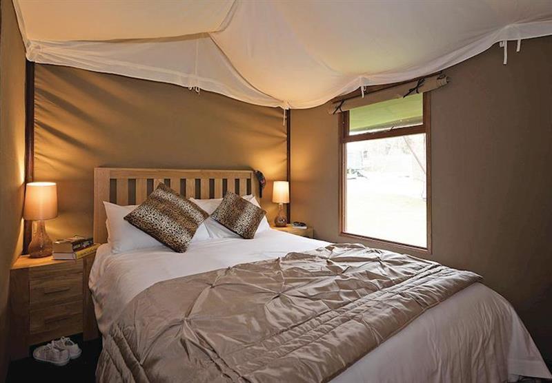 Double bedroom in Exclusive Safari Tent 3 at Waterside Safari Tents in Weymouth, Dorset