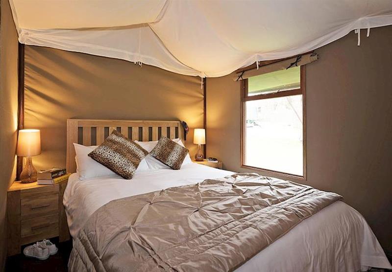 Double bedroom in the Safari Tent 3 at Waterside Safari Tents in Weymouth, Dorset