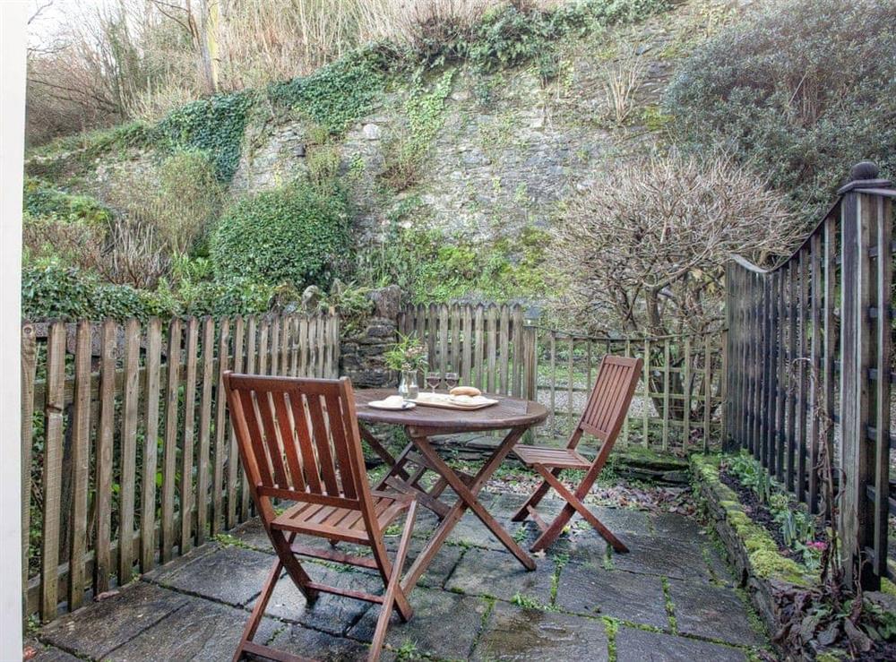 Enclosed patio area at Waterwheel in Bow Creek, Nr Totnes, South Devon., Great Britain