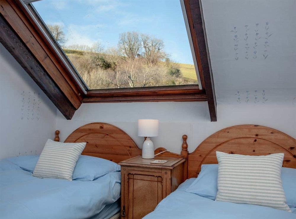 Light and airy twin bedroom with cot at Waterwheel in Bow Creek, Nr Totnes, South Devon., Great Britain