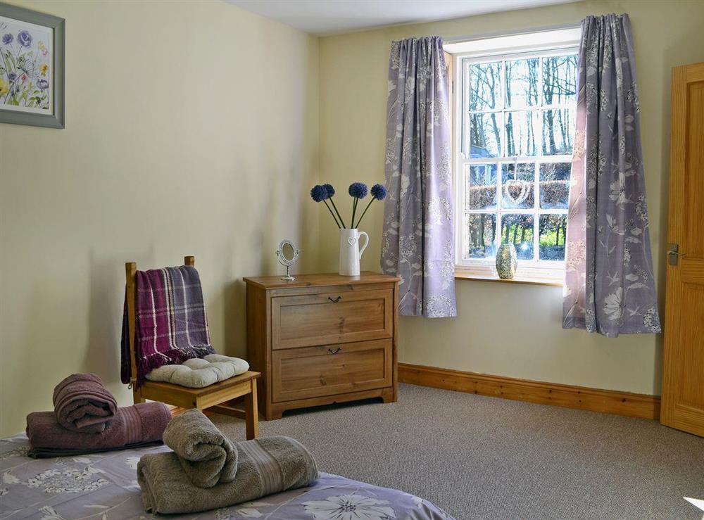 Double bedroom full of character at Waulkmill Cottage in Carronbridge near Thornhill, Dumfriesshire