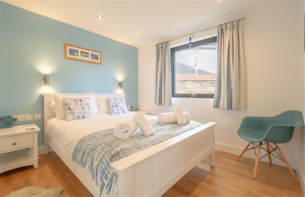 Bedroom one with king-size bed at Wavelength, Chapel Porth, St Agnes