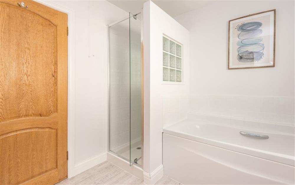 Ground floor family bathroom with shower  at Wavelet in Challaborough