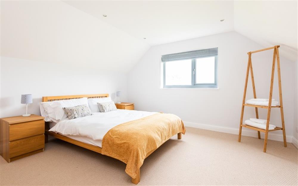 Rear facing double bedroom on first floor at Wavelet in Challaborough