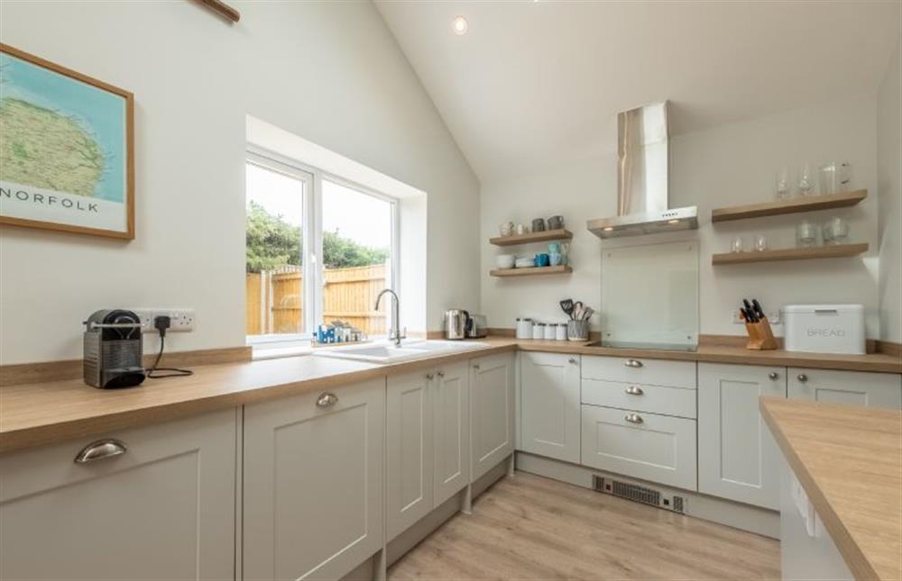 A smart well-equipped fitted kitchen at Waveney House, Wells-next-the-Sea