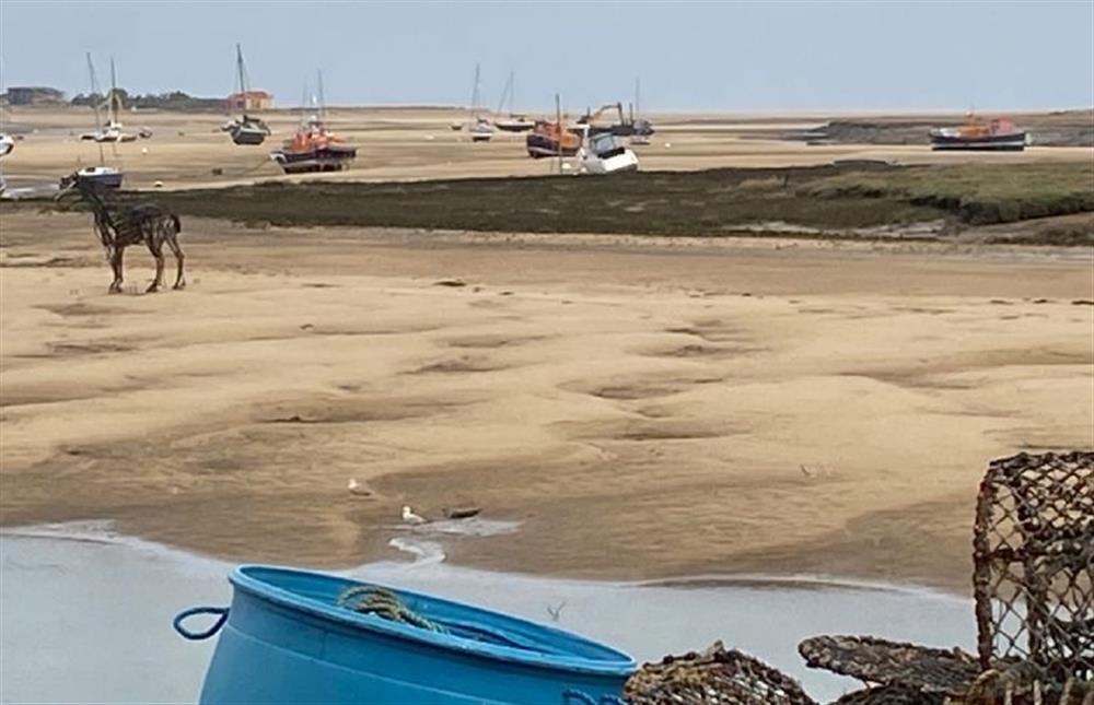 The Quay at low tide showing the Lifeboat Horse sculpture at Waveney House, Wells-next-the-Sea
