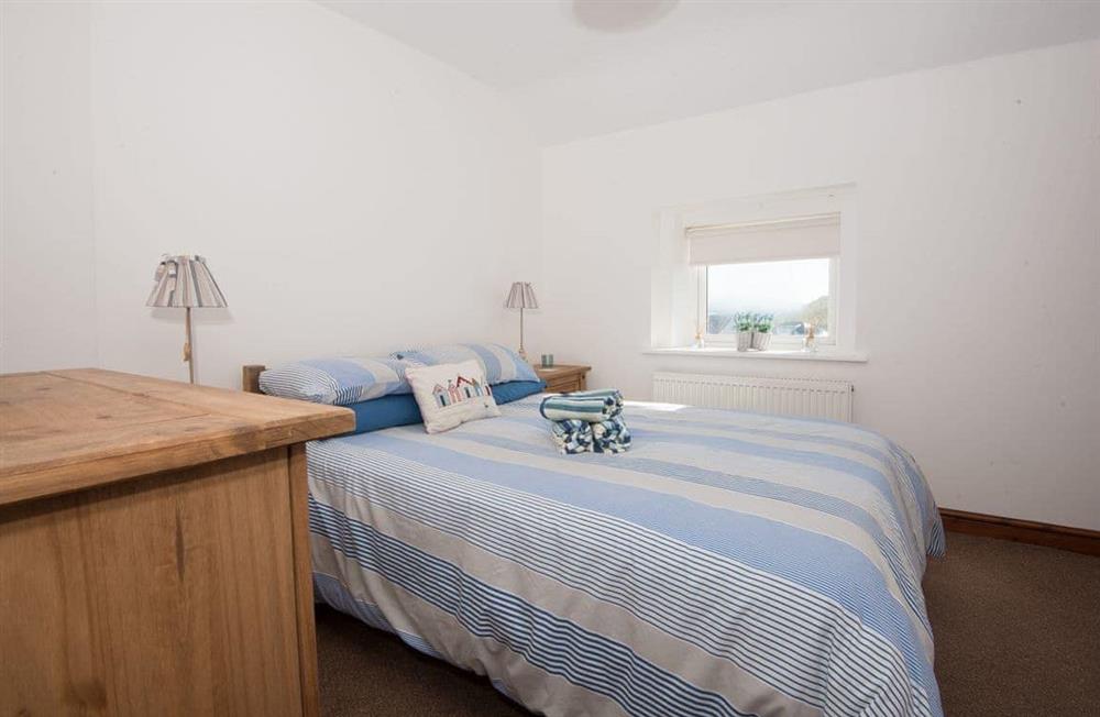 A bedroom in Waves at Ocean House at Waves at Ocean House in Caernarfon, Gwynedd