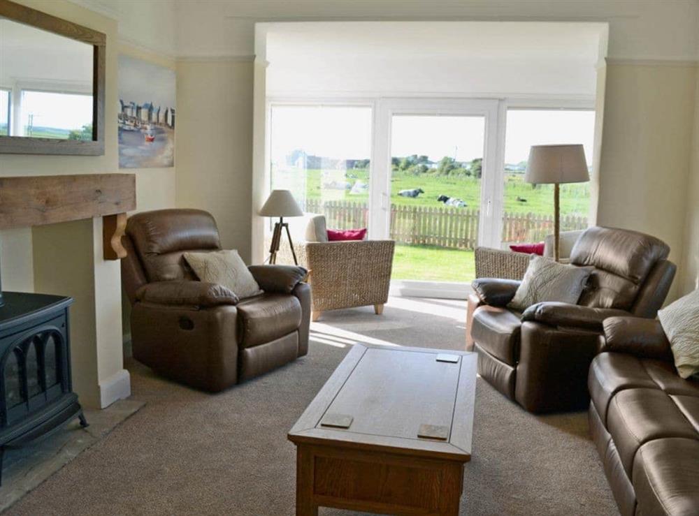 Spacious living room with patio doors at Wayside in Beadnell, Northumberland