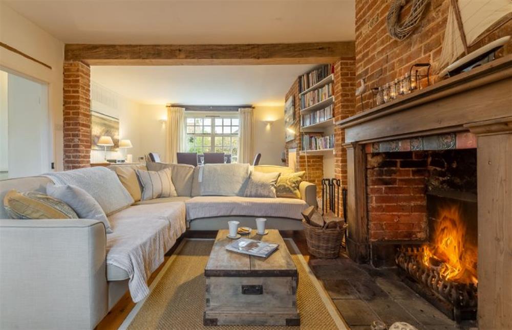 Ground floor:  Cosy sitting room with open fire at Weavers Cottage, Docking near Kings Lynn