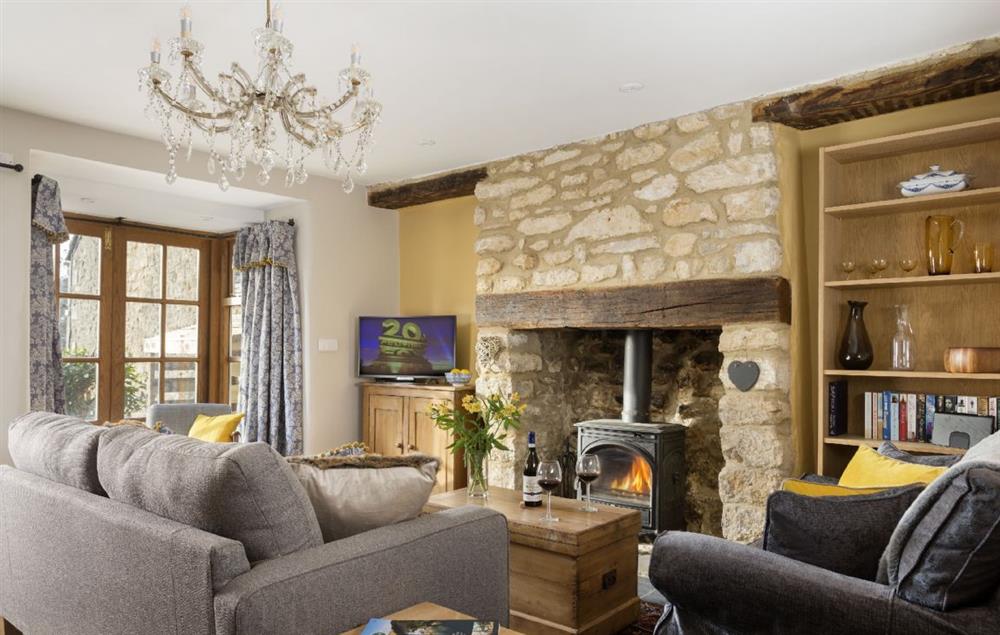 Ground floor: Sitting room with wood burner at Weavers Cottage, Watledge