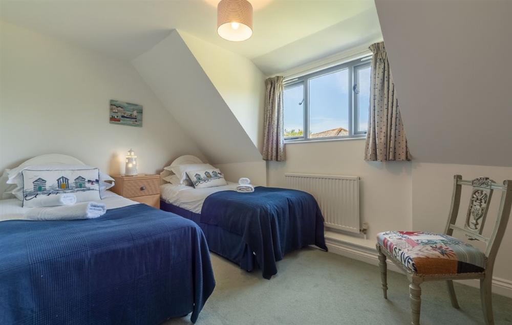 Bedroom three with twin single beds and en-suite wet room at Wedge Cottage, Roserrow