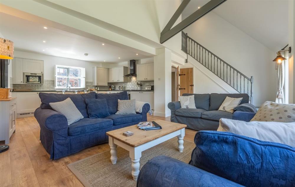 Large open-plan living area with exposed beams (photo 2) at Wedge Cottage, Roserrow