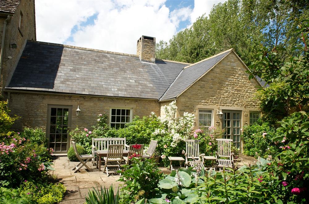 The rear garden is perfect for alfresco dining too  at Weir House, Bruern, near Chipping Norton