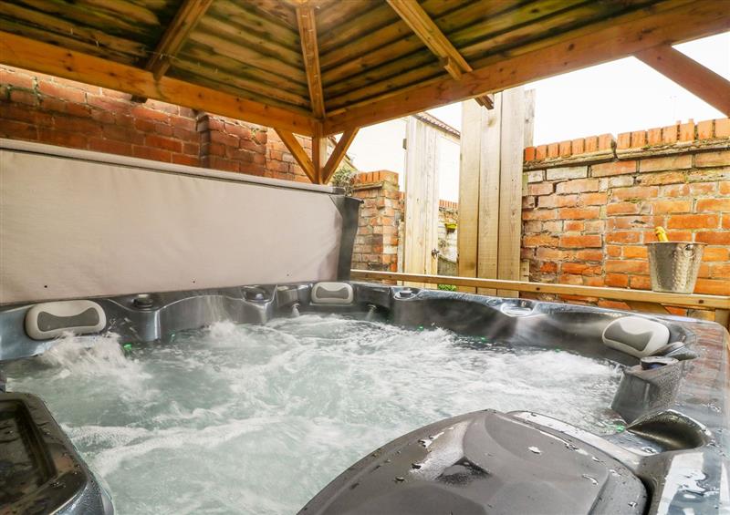 Enjoy the hot tub at Well Cottage, Leven Near Beverley