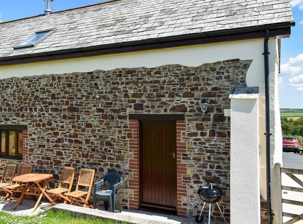 Patio with garden furniture and BBQ at Cider Cottage, 