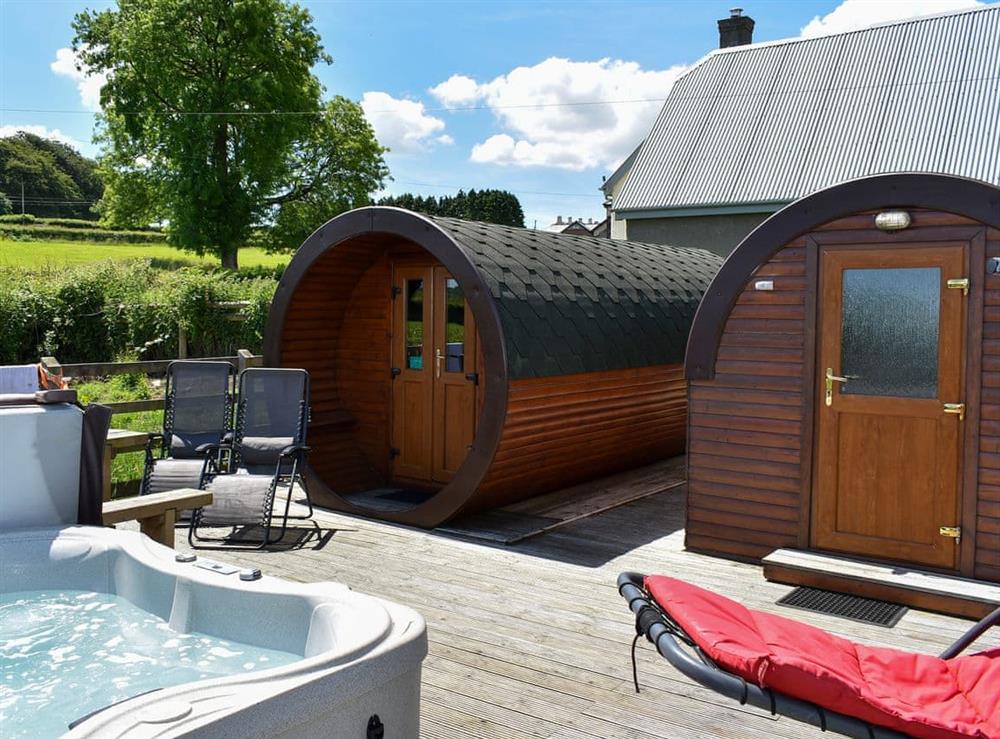 Cedar-clad cylindrical ’Hobbit-style’ pod at Rivendell Glamping Pod, 