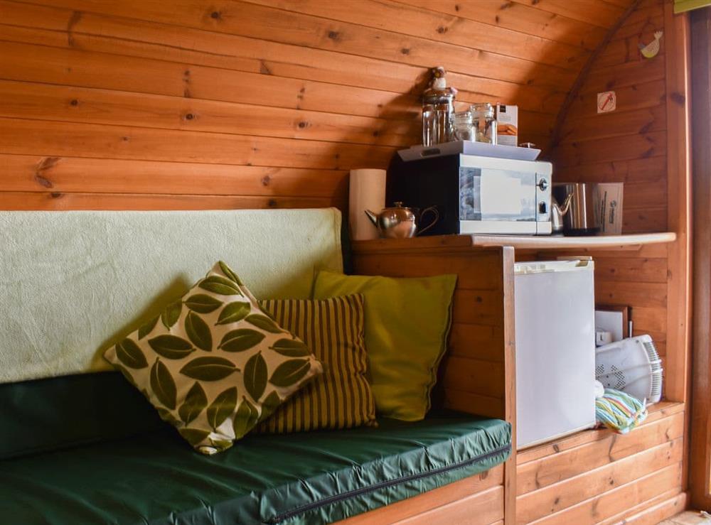 Modest kitchen/sitting area at Rivendell Glamping Pod, 