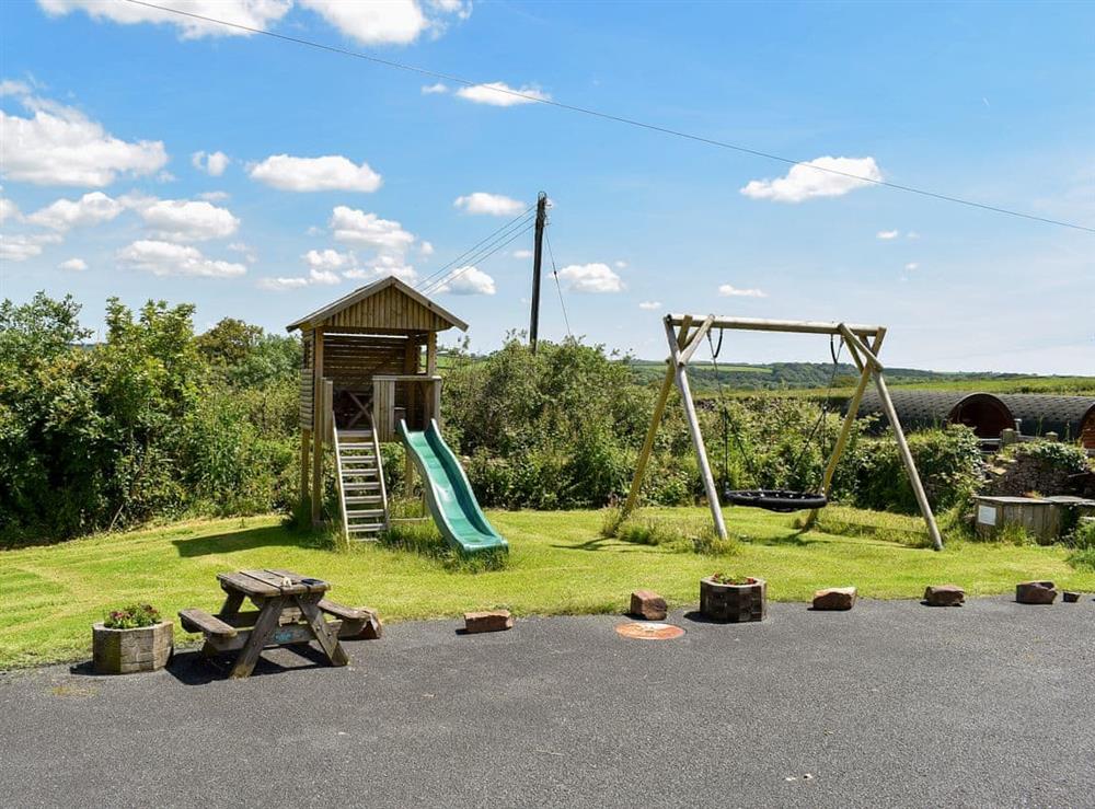 Shared children’s play area at Rivendell Glamping Pod, 