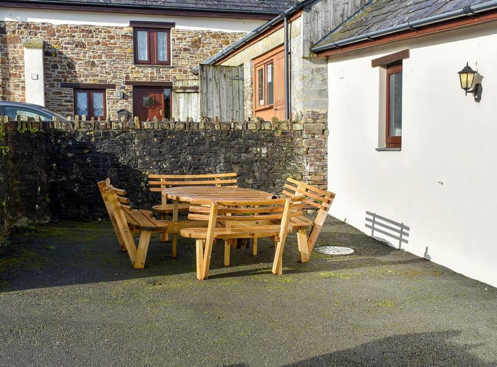 Private courtyard with garden furniture at Trewin Court, 