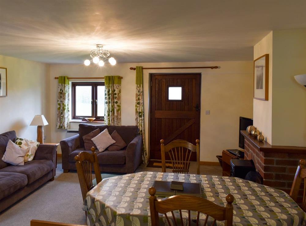 Spacious living and dining area at Trewin Court, 