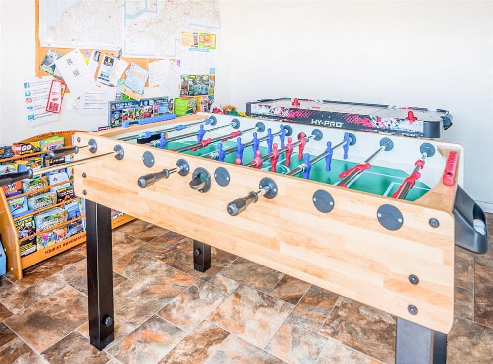Shared games room and tourist information at Well Farm Cottage, 